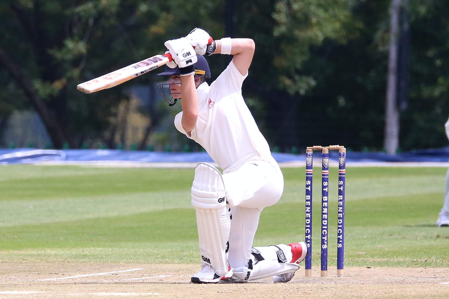 man in white jersey shirt and white pants playing cricket