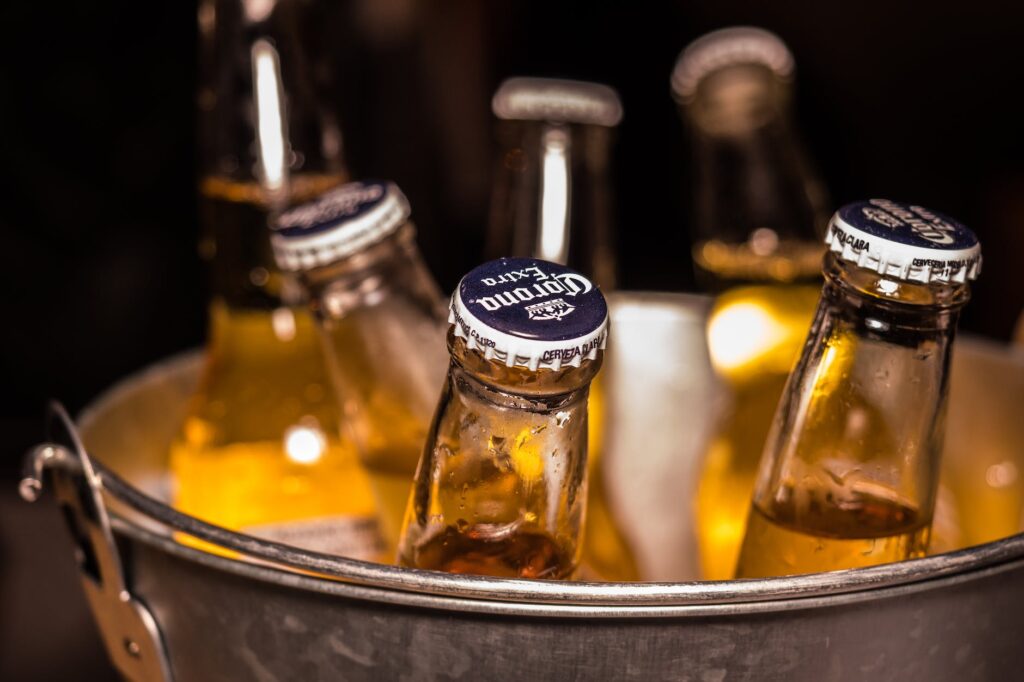 photo of corona extra bottles on bucket