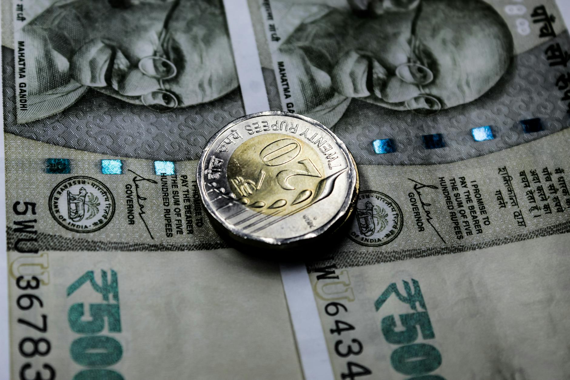 close up shot of a coin on banknote